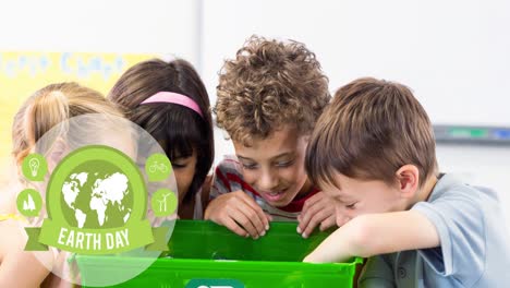 Animation-of-earth-day-text-and-globe-logo-over-smiling-children-looking-in-recycling-box