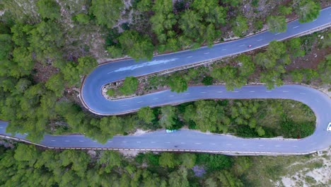 birds eye view on twisting winding vehicle highway, automobile journey, steep island drive