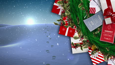 animación de regalos y nieve cayendo sobre el paisaje de invierno