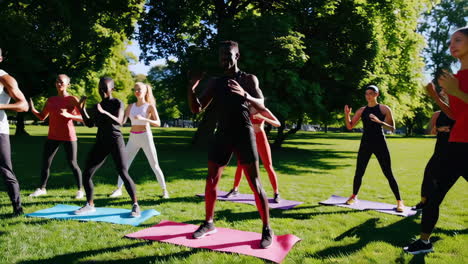 diverse group exercising in a park