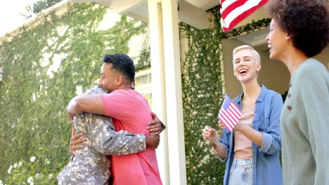 happy diverse male soldier embracing his friends with american flag