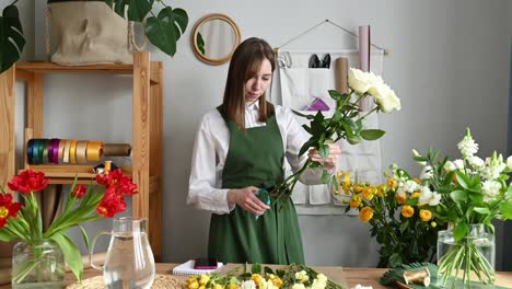 woman arranging flowers in vase