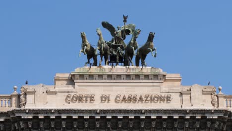 The-bronze-statue-on-top-of-the-Supreme-Court-of-Cassation-in-Rome,-Italy