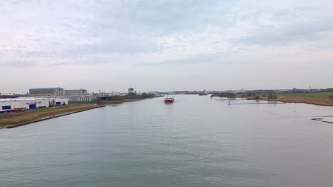 flying towards the marjatta cargo ship in zwijndrecht netherlands, europe, aerial footage