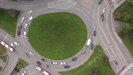 traffic driving in roundabout in roslagstull, stockholm, sweden