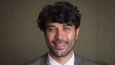 close up portrait of young middle eastern man.