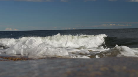 waves hit höga kusten, rotsidan on the high coast of kvarken, located on the east coast of sweden