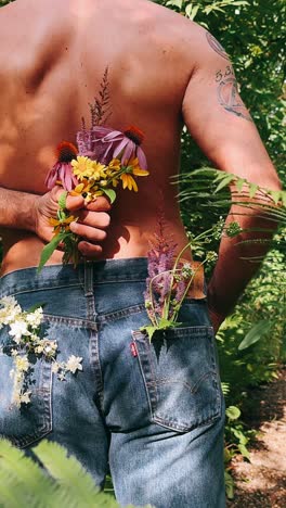 man with flowers in nature