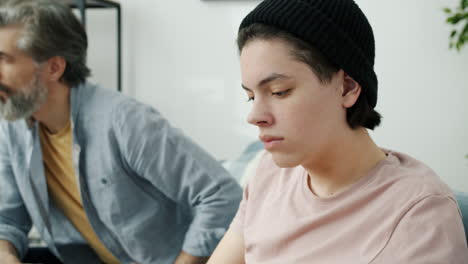 teenager and father arguing