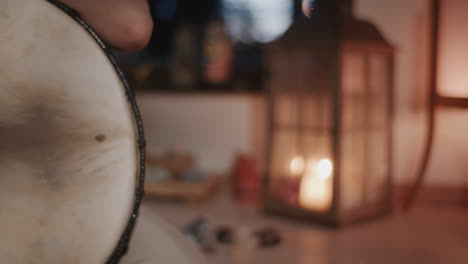 person playing a hand drum