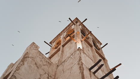 Traditional-Wind-Tower-On-an-old-house-in-the-Historical-Neighborhood-Of-Al-Fahidi,-Dubai,-United-Arab-Emirates