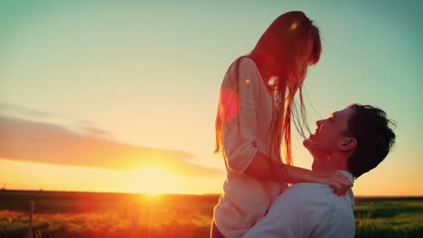 romantic couple having fun in field