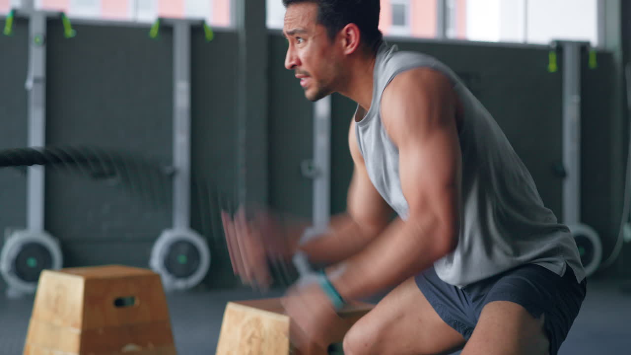 Exercise, rope workout and a man in gym training
