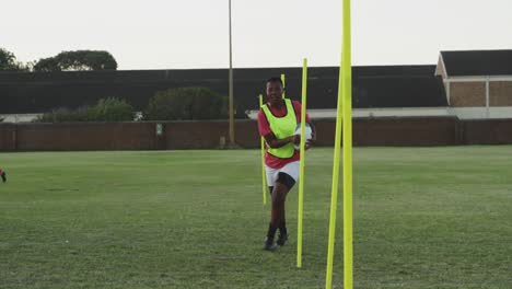 Young-adult-female-rugby-team-training