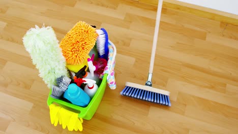 various housekeeping supplies in a bucket