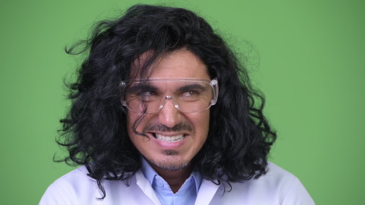Crazy scientist wearing protective glasses planning something