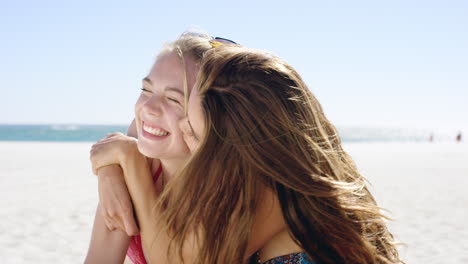 beautiful young woman giving teenage girl friend kiss on cheek hugging each other on vacation