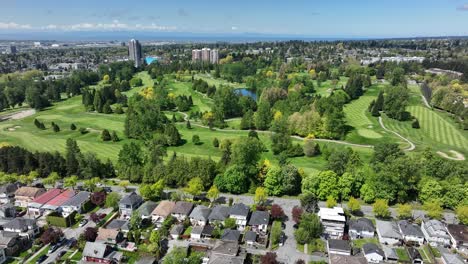 evergreen and lush meadows of a golf course in oakridge community in vancouver, canada