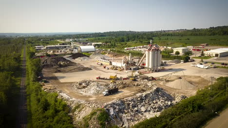 drone circling around a bustling industrial mining facility