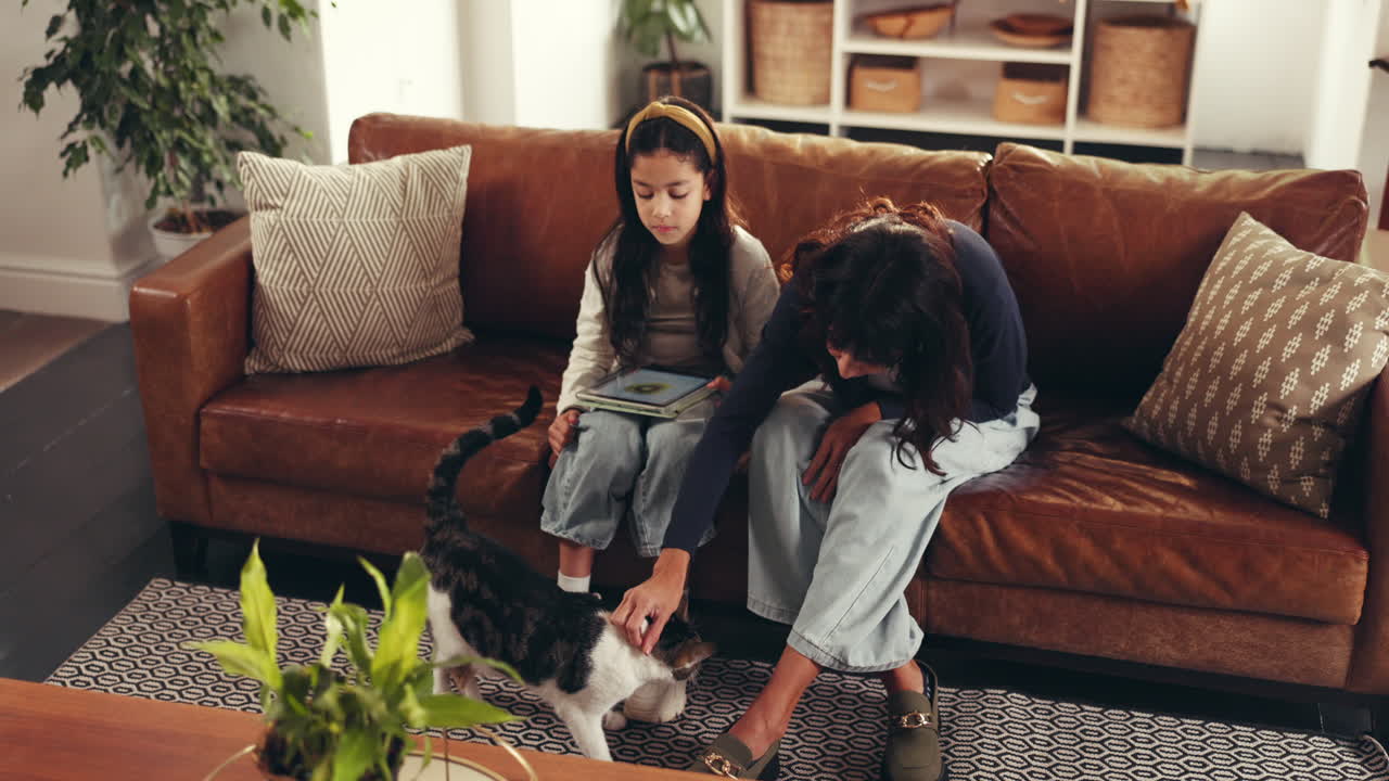 Family with Cat Relaxing on Couch in Living Room