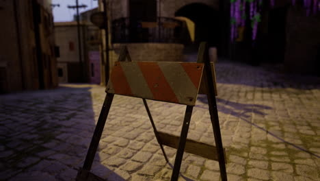 street construction barrier in an old town during twilight hours