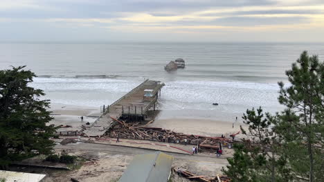 broken wooden pier after severe storm