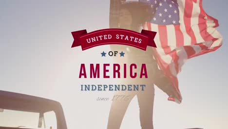 Young-mixed-race-woman-holding-US-flag-with-independence-date-foreground