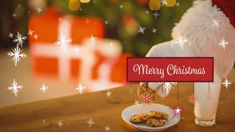 animation of snow falling and merry christmas text over santa claus taking cookie