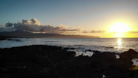 a sunset in hawaii from the north coast of oahu.