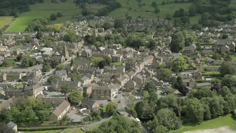 An-aerial-view-of-the-Yorkshire-town-of-Pateley-Bridge-on-a-cloudy-summer-morning,-England,-UK