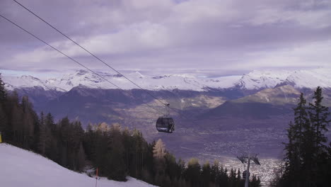 4k tilt down shot of mountain ski resort on a bluebird ski day,