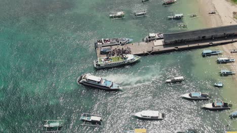 aerial footage ferries departing from padang bai harbor in bali, indonesia