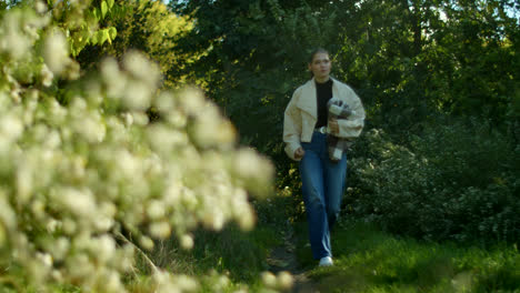 woman walking in a spring park