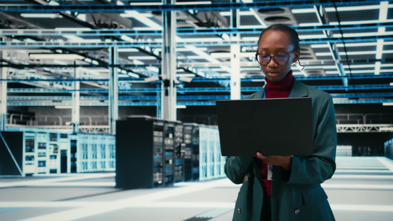 Female IT Engineer Managing Servers in Modern Data Center