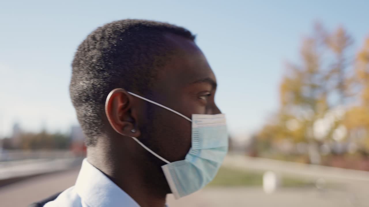 Man Wearing Mask Walking Outside