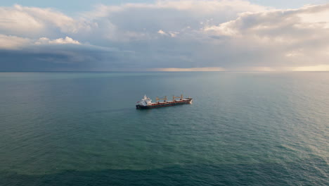 container tanker floating at endless ocean drone view. cargo ship moving in sea