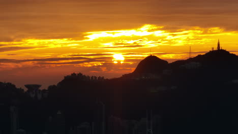 Rising-shot-over-Beautiful-Silhouetted-Mountain-Range-During-Sunrise