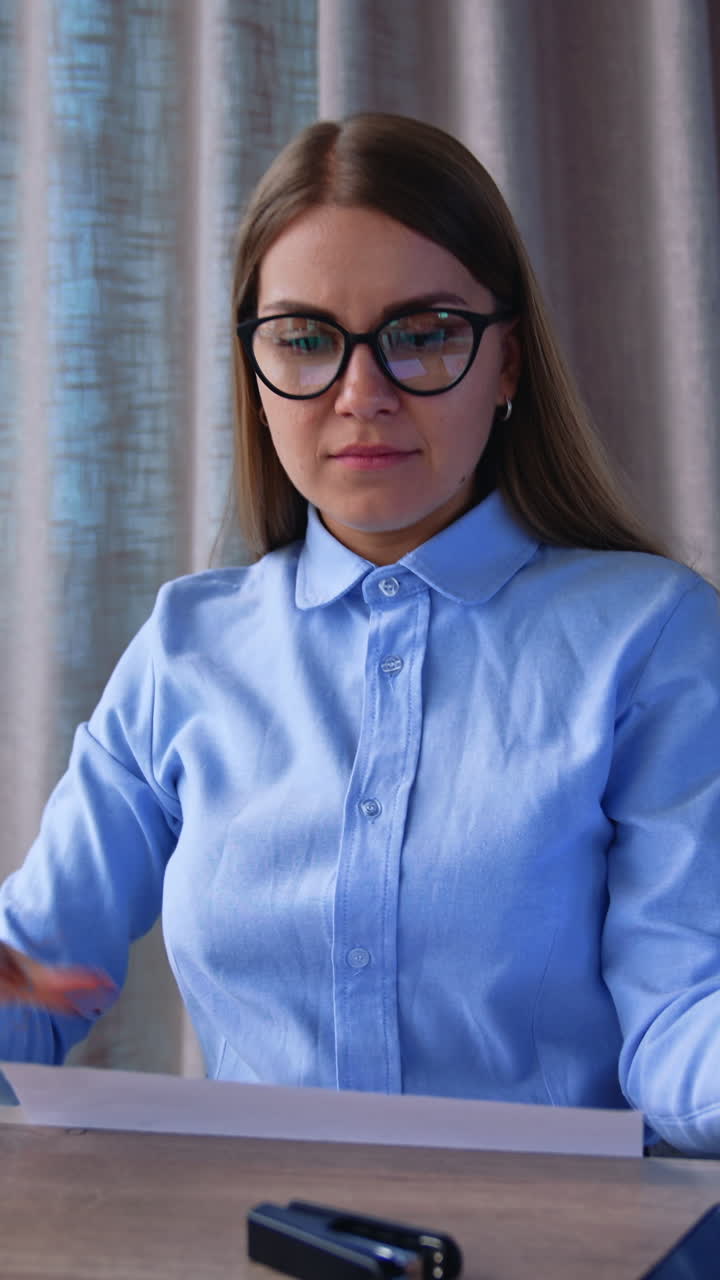 Business female manager throwing paper toss. Lifestyle business triupmh. Vertical video