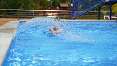 surface of blue swimming pool. swimming pool bottom ripple and flow waves background with fountain