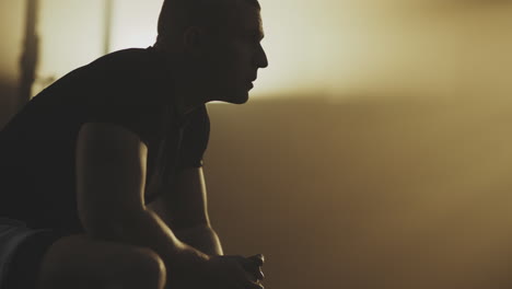 silhouette of a man in profile, resting