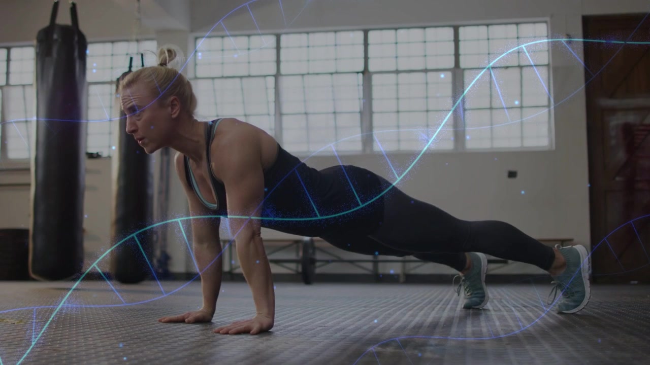 Woman starting pushups by elbow bend, lowering then pressing up for fitness with DNA helix syncing
