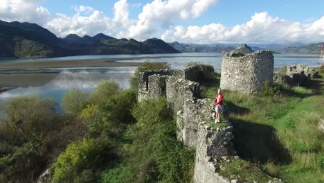 aerial view of a historic castle ruins by the lake