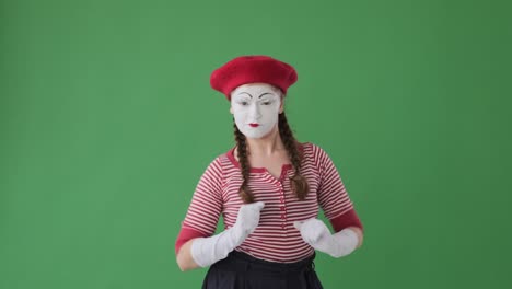 mime artist dancing over green background