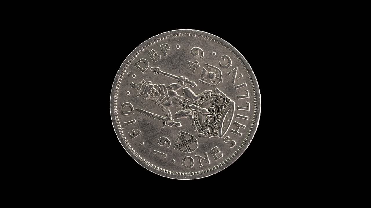 United Kingdom 1949 one shilling coin reverse with crowned lion rotating on black background