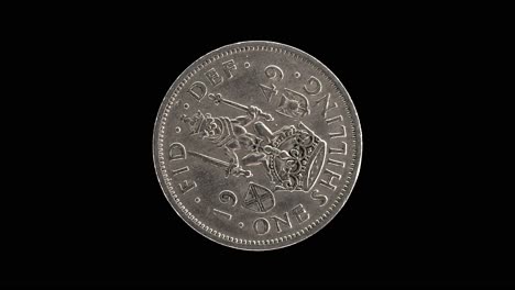 united kingdom 1949 one shilling coin reverse with crowned lion rotating on black background
