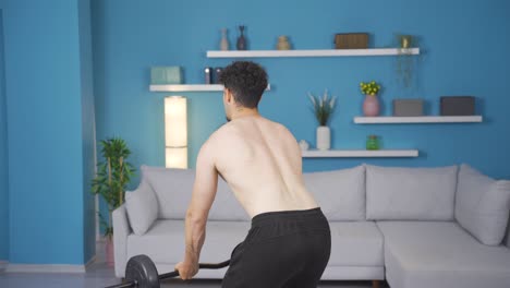 athletic young man exercising with barbell, arm muscle. muscular body.