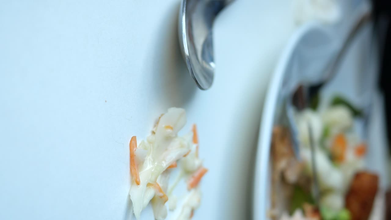 Coleslaw on a plate, food leftovers