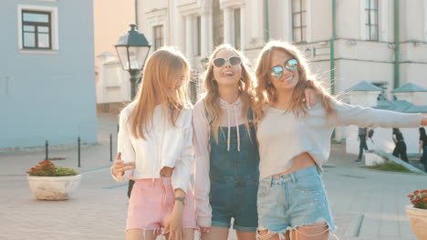 happy friends in trendy summer outfits