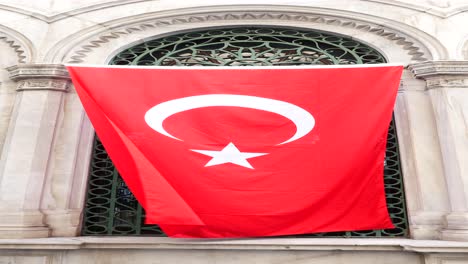 turkish flag hanging from a window