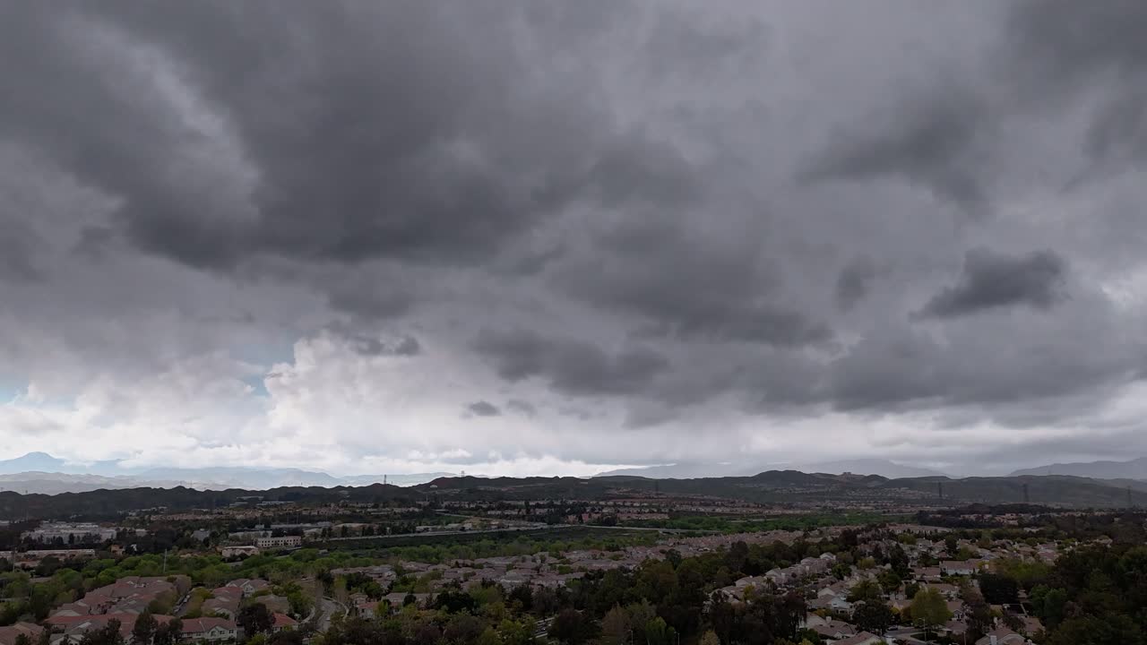 Aerial of clouds over a housing track